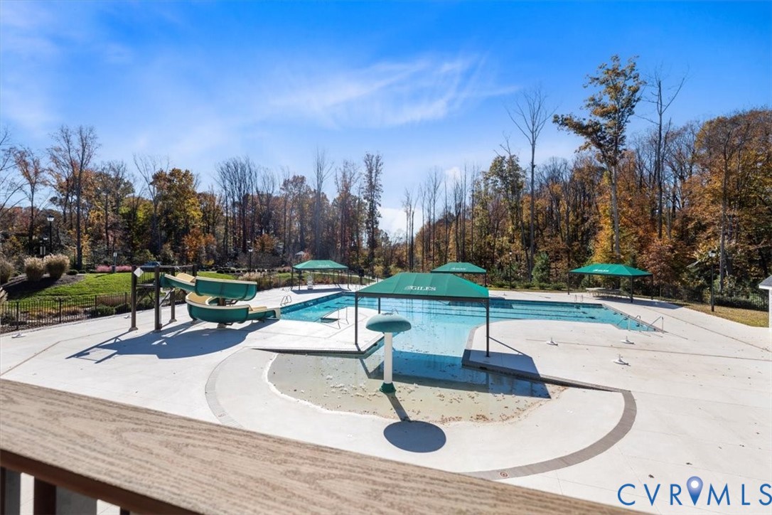 9002 Spring Green Loop Mechanicsville, VA 23116 - Photo 42 of 47 Community pool featuring a patio area, a water sli