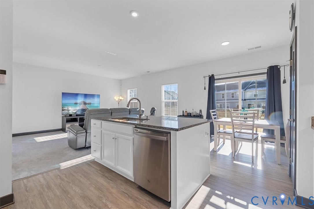 9002 Spring Green Loop Mechanicsville, VA 23116 - Photo 9 of 47 Kitchen with white cabinetry, stainless steel dish