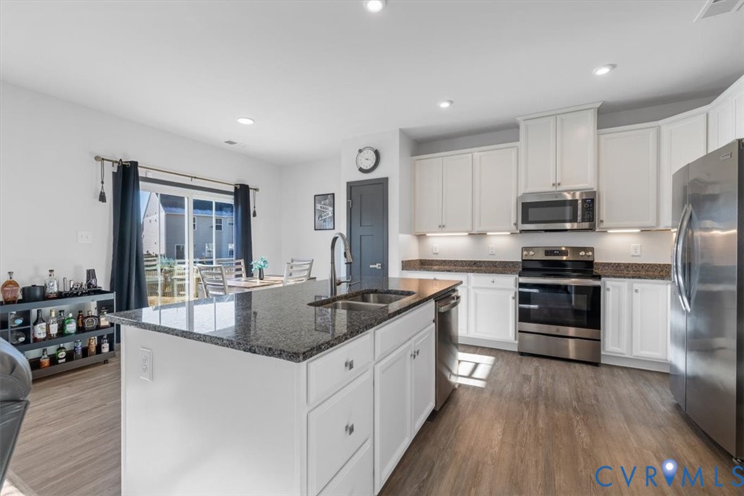 9002 Spring Green Loop Mechanicsville, VA 23116 - Photo 10 of 47 Kitchen with stainless steel appliances, dark ston