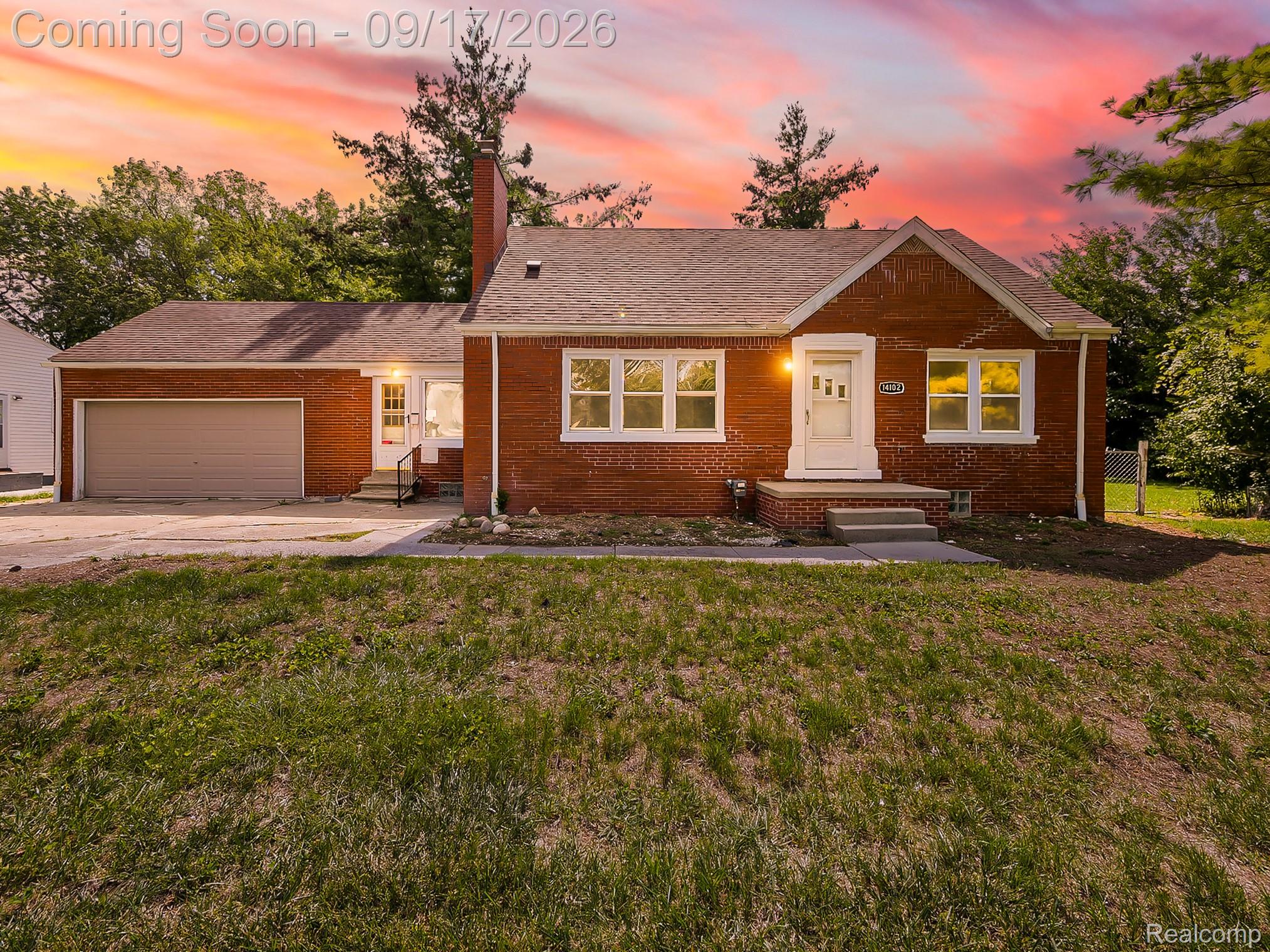 14102 Toepfer Road Warren, MI 48089 - Photo 35 of 39 Brick exterior with a covered entry, integrated garage, white-framed windows, and a prominent chimney