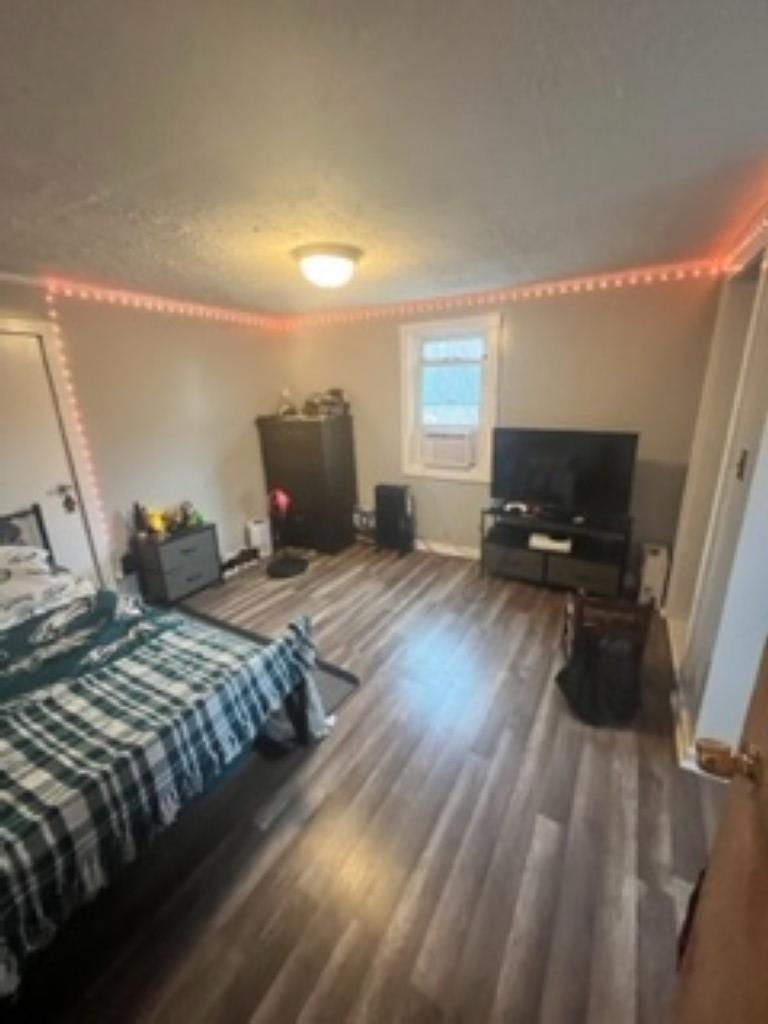 3016 Lyndhurst Road Stuarts Draft, VA 24477 - Photo 11 of 15 a bedroom with a bed and wooden floor