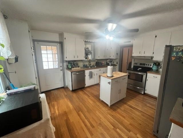 3016 Lyndhurst Road Stuarts Draft, VA 24477 - Photo 4 of 15 a kitchen with a sink wooden floor and stainless steel appliances