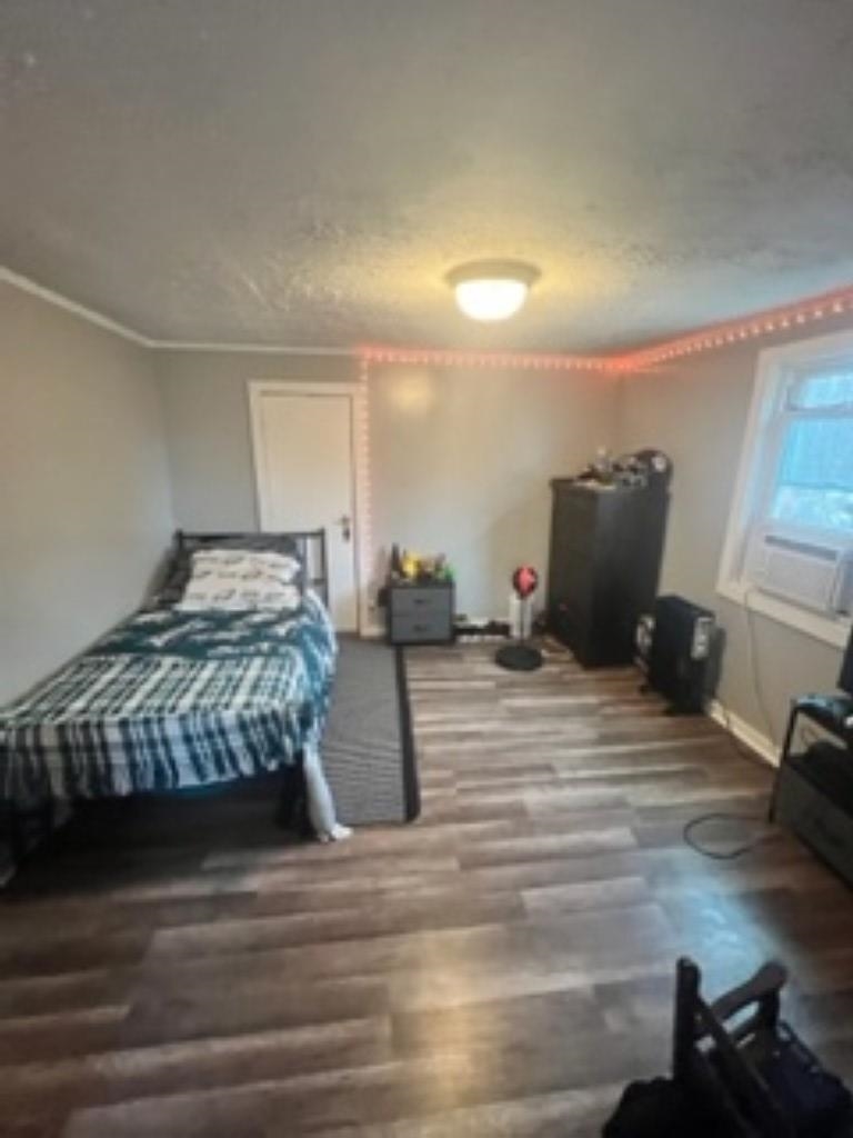 3016 Lyndhurst Road Stuarts Draft, VA 24477 - Photo 10 of 15 a bedroom with a bed and wooden floor