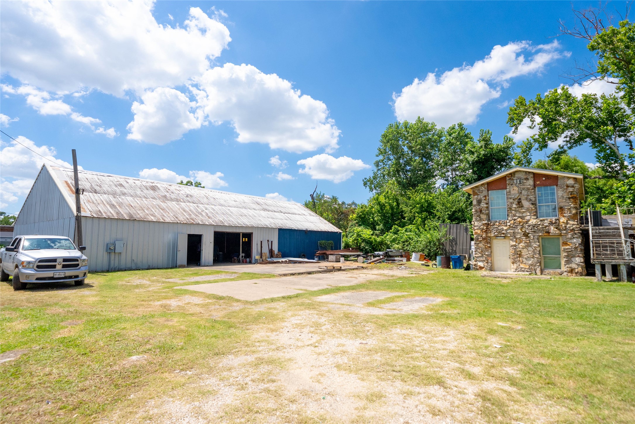 a view of a house with a swimming pool and a yard