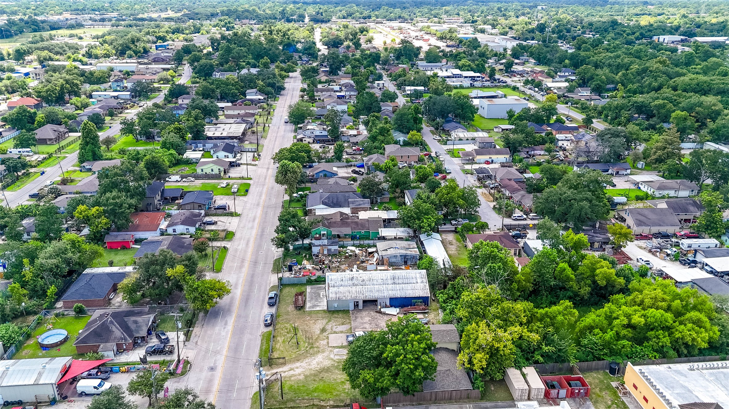 1939 Hopper Road Houston, TX 77093 - Photo 11 of 18 an aerial view of residential houses with outdoor space and trees all around