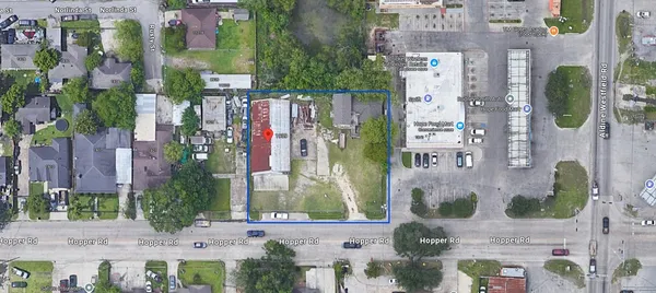 a aerial view of multi story residential apartment building with yard