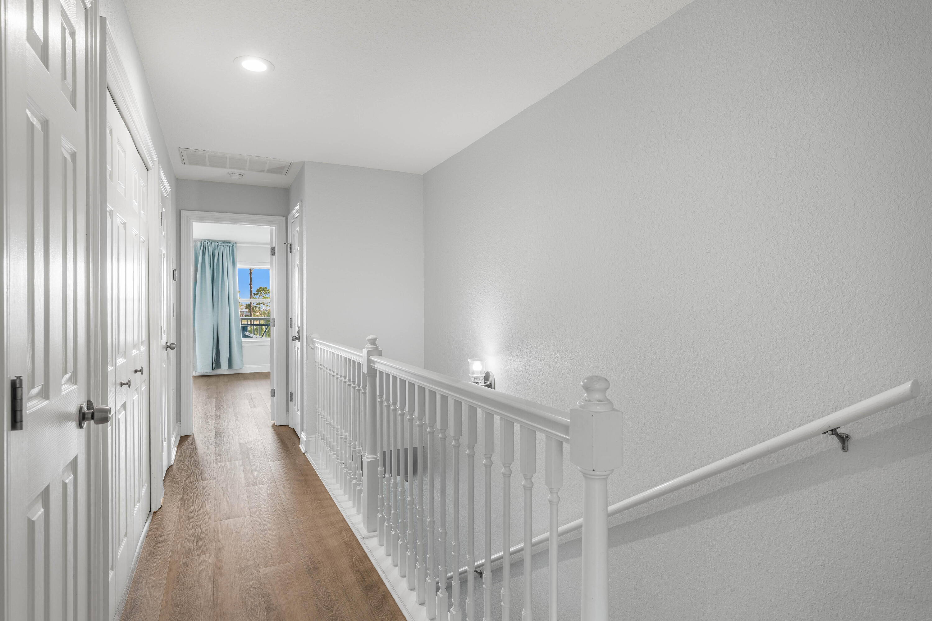 33 Dune Breeze Lane, Unit H2 Santa Rosa Beach, FL 32459 - Photo 26 of 54 a view of a hallway with wooden floor and entryway