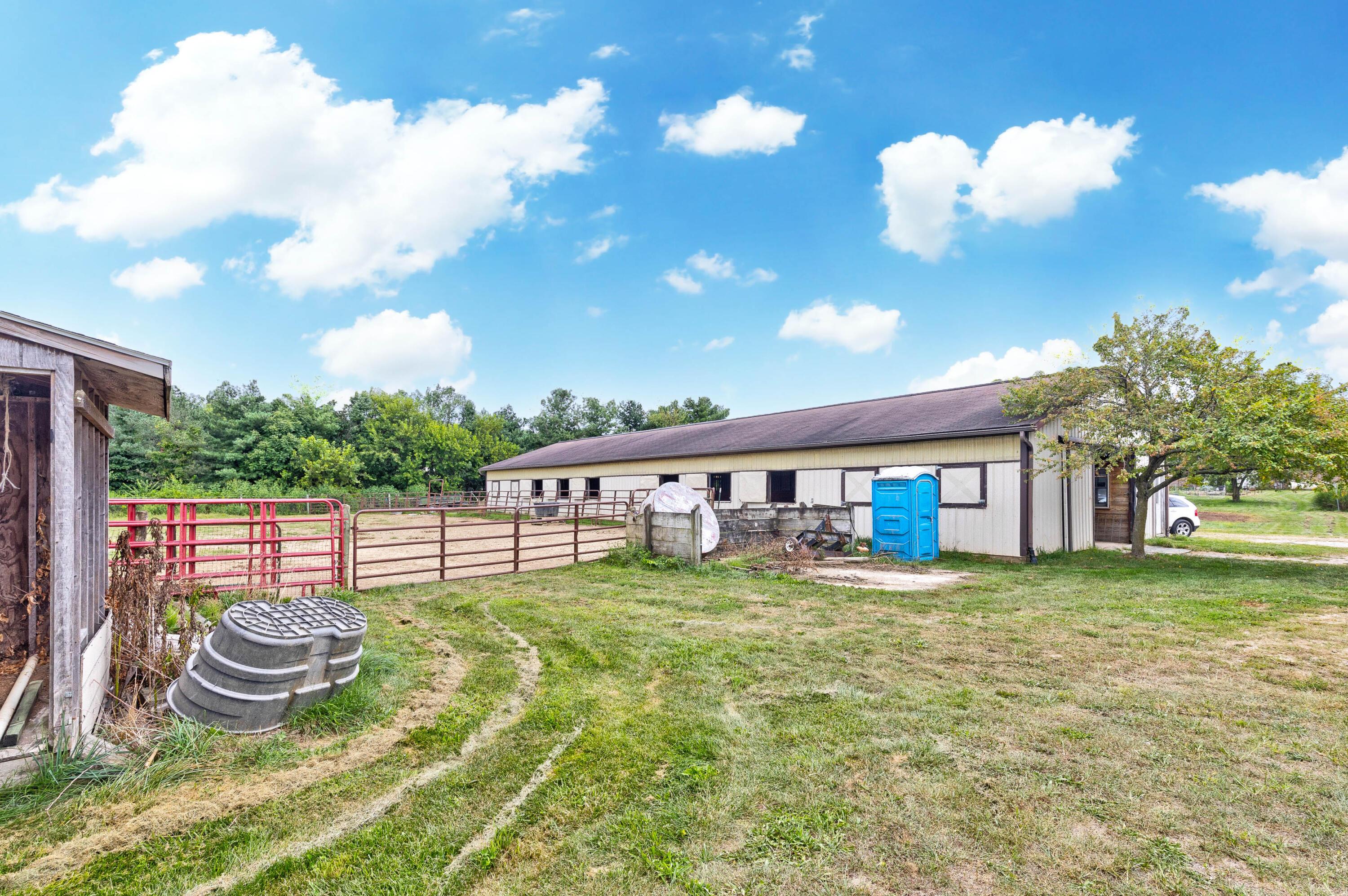 8558 Morris Road Hilliard, OH 43026 - Photo 32 of 74 • Steel exterior • Pyranha® fly spray system • Concrete isle way • 19 stalls (Matted) • New stall windows ~ 2021 • Fluorescent lighting • Open stalls