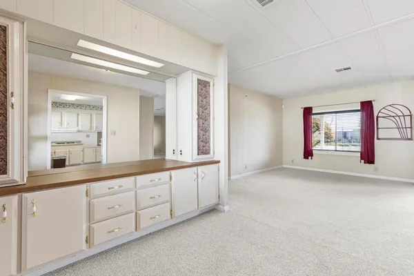 a large white room with window