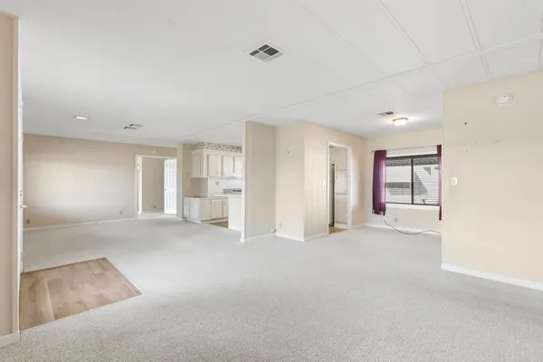 a view of empty room with windows