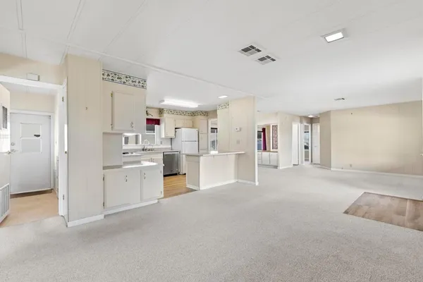 a view of a kitchen with appliances and cabinets
