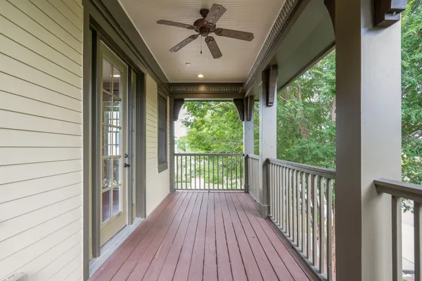 a view of a porch with wooden floor and outdoor space