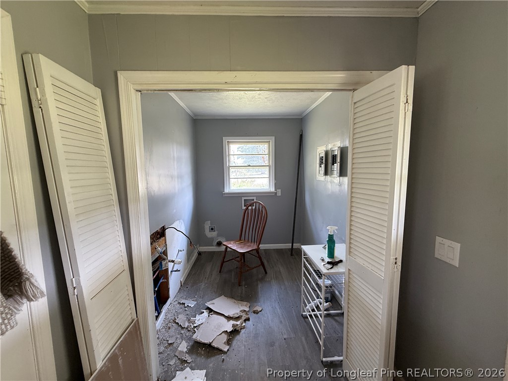 736 Tobermory Road Fayetteville, NC 28306 - Photo 12 of 17 a view of a hallway with couch and mirrors
