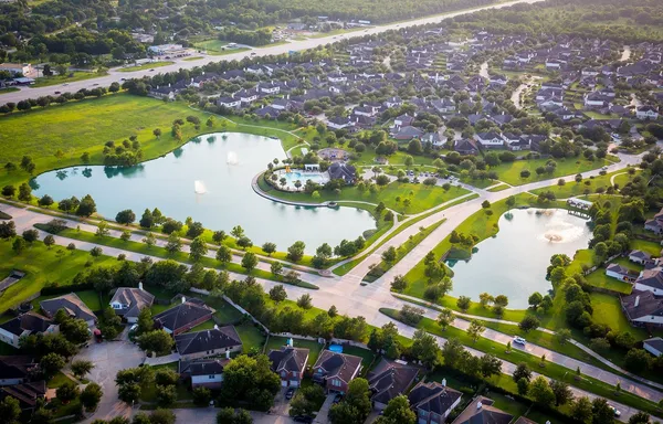 an aerial view of residential houses with outdoor space