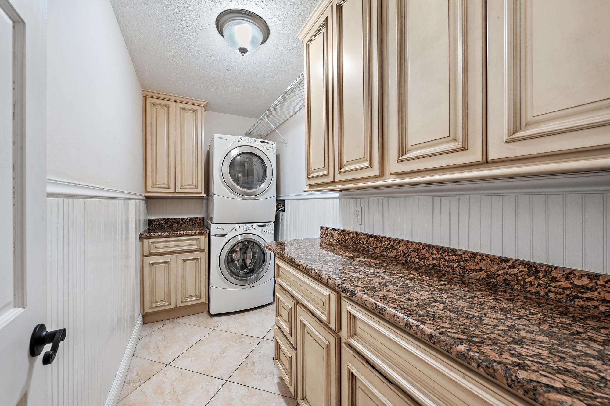 19150 Southeast Jupiter Road Jupiter, FL 33458 - Photo 14 of 43 a utility room with sink dryer and washer