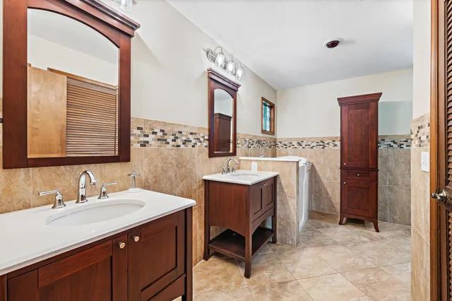 a bathroom with a toilet sink and shower