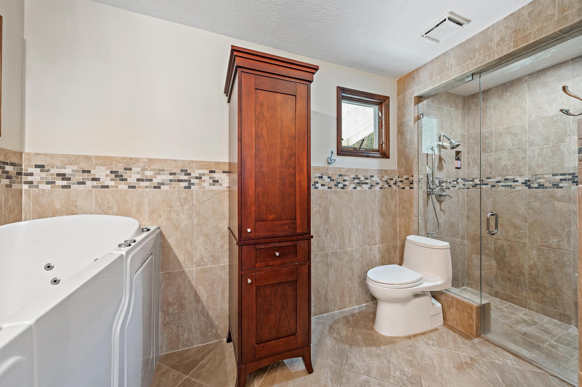 19150 Southeast Jupiter Road Jupiter, FL 33458 - Photo 20 of 43 a bathroom with a toilet sink and shower