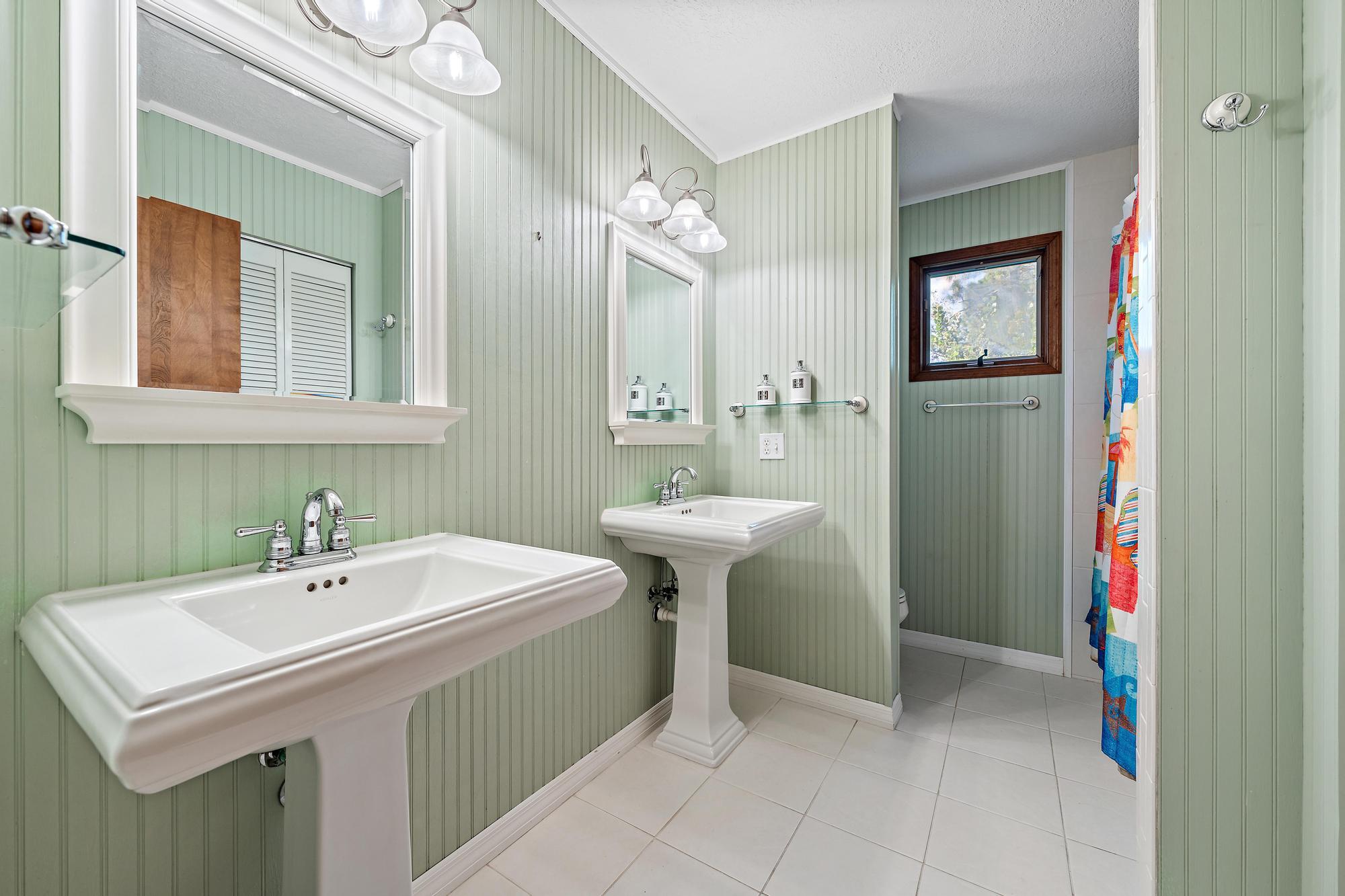 19150 Southeast Jupiter Road Jupiter, FL 33458 - Photo 24 of 43 a bathroom with a sink and a mirror