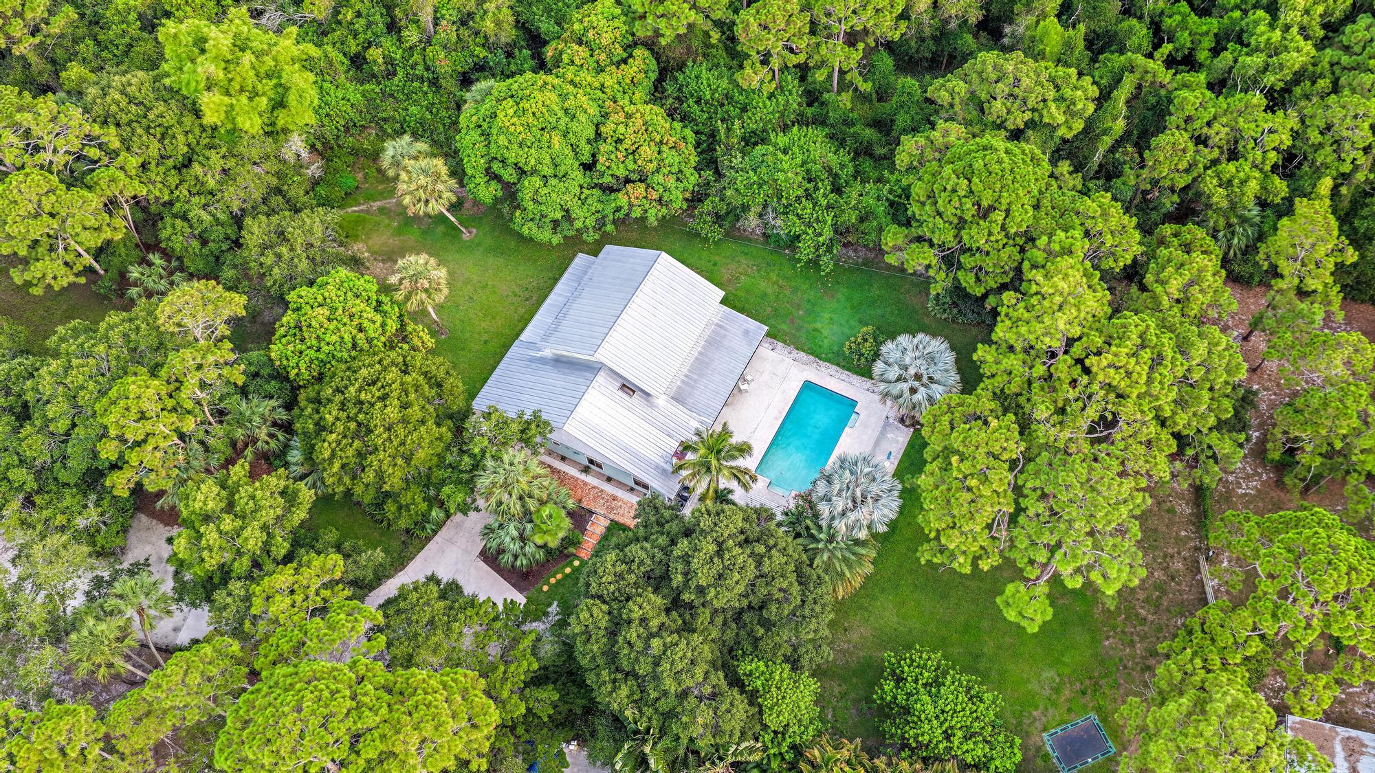 19150 Southeast Jupiter Road Jupiter, FL 33458 - Photo 35 of 43 an aerial view of a house with a yard and trees