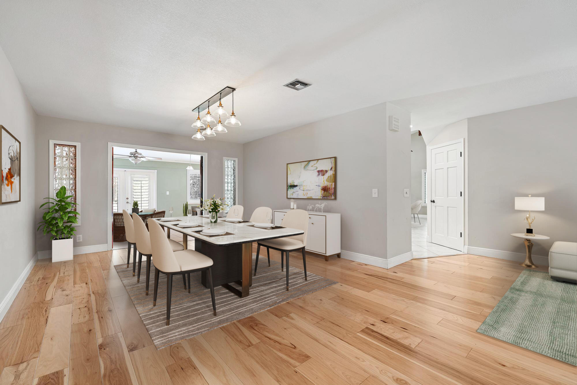 19150 Southeast Jupiter Road Jupiter, FL 33458 - Photo 7 of 43 a dining room with wooden floor and breakfast area