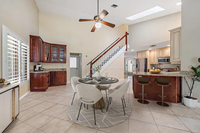 a view of kitchen with sink and cabinets