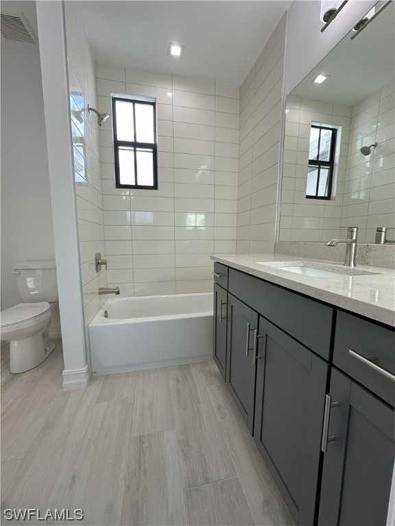 7464 Rockefeller Drive Naples, FL 34119 - Photo 11 of 22 a spacious bathroom with a bathtub sink mirror and toilet