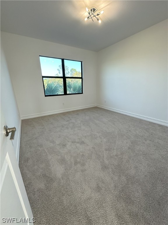 7464 Rockefeller Drive Naples, FL 34119 - Photo 14 of 22 an empty room with a window