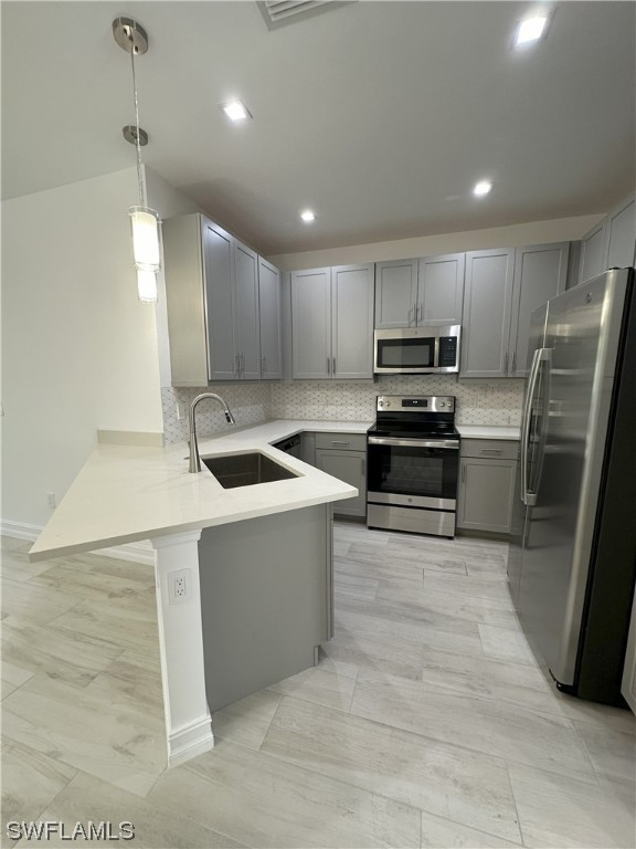 7464 Rockefeller Drive Naples, FL 34119 - Photo 2 of 22 a kitchen with stainless steel appliances granite countertop a refrigerator a stove a sink and a oven