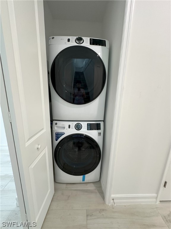 7464 Rockefeller Drive Naples, FL 34119 - Photo 9 of 22 a utility room with dryer and washer