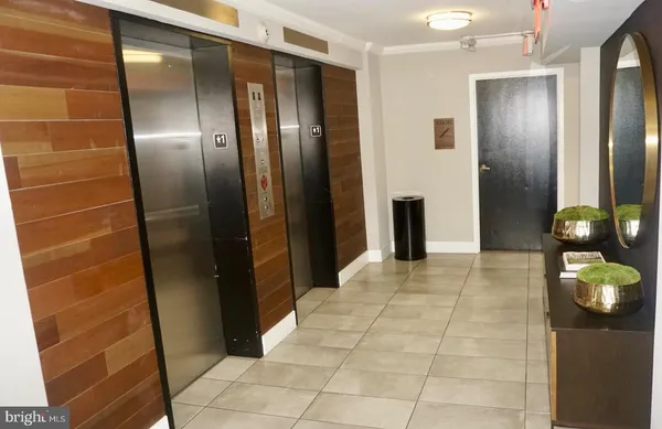a bathroom with a shower and a mirror
