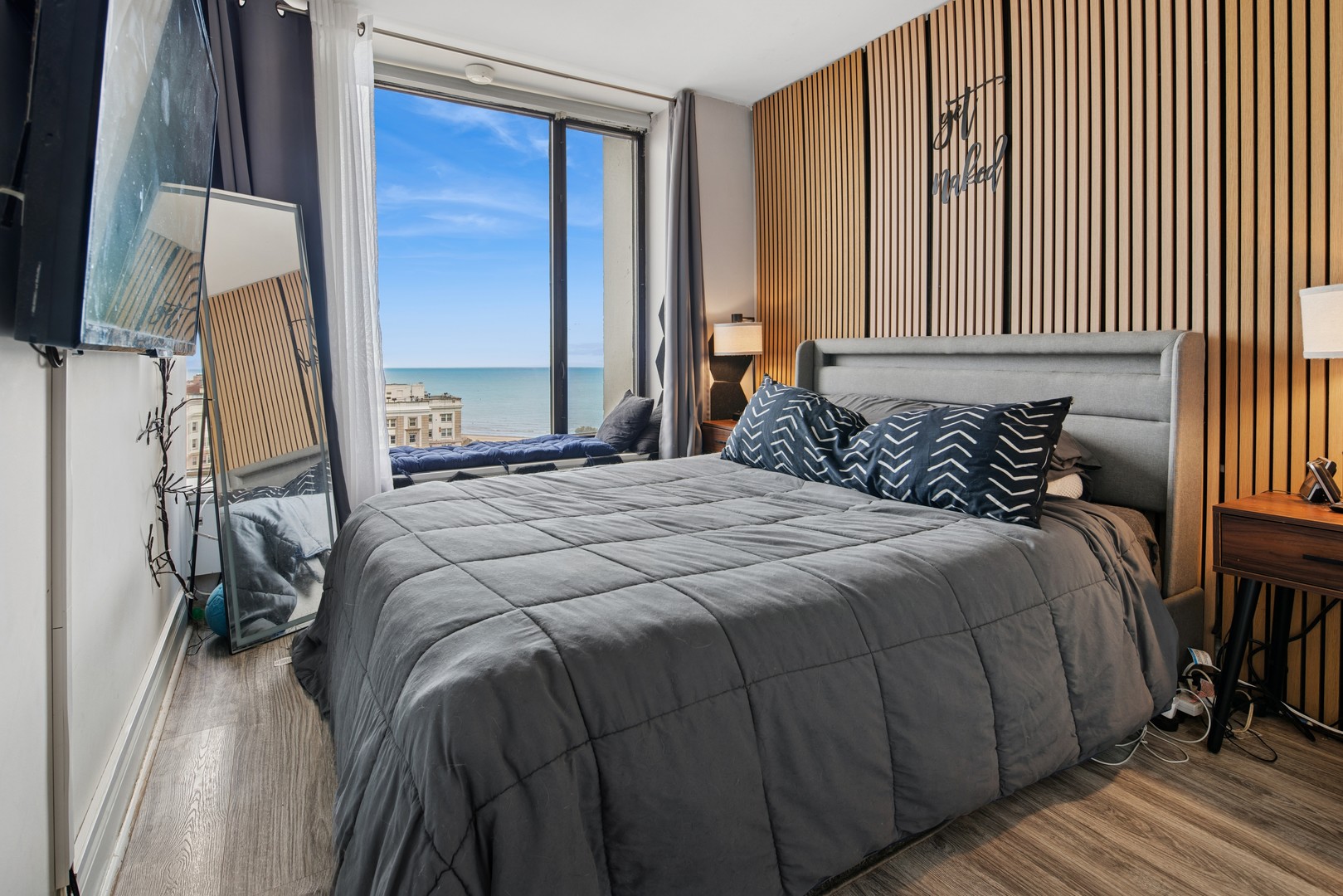 5455 North Sheridan Road, Unit 2805 Chicago, IL 60640 - Photo 13 of 20 a bedroom with a bed and a window