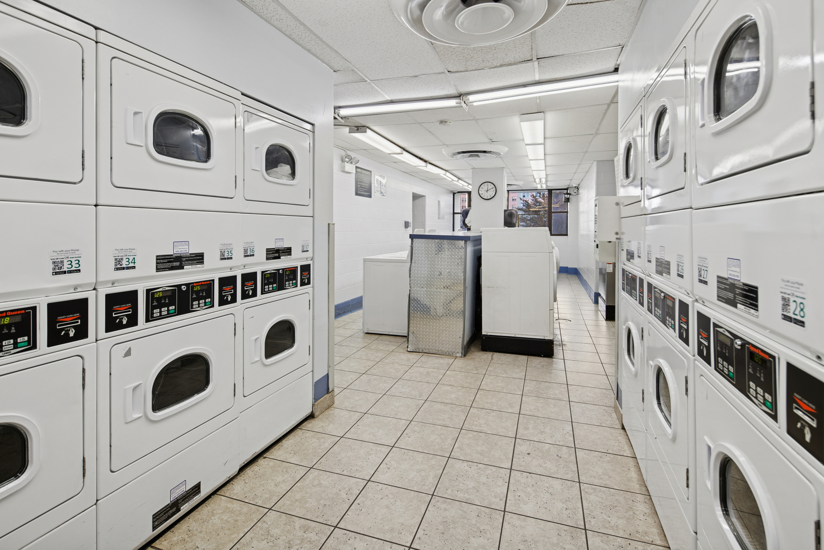 5455 North Sheridan Road, Unit 2805 Chicago, IL 60640 - Photo 17 of 20 a utility room with dryer and washer