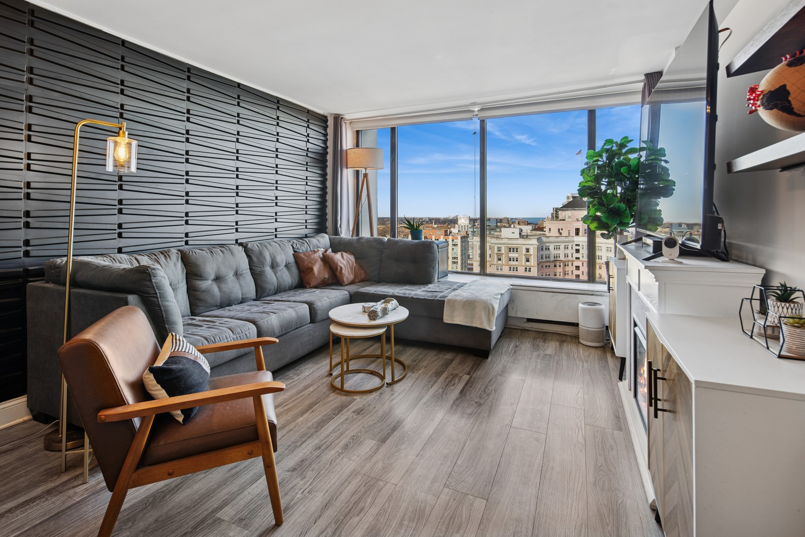 5455 North Sheridan Road, Unit 2805 Chicago, IL 60640 - Photo 3 of 20 a living room with furniture and a large window