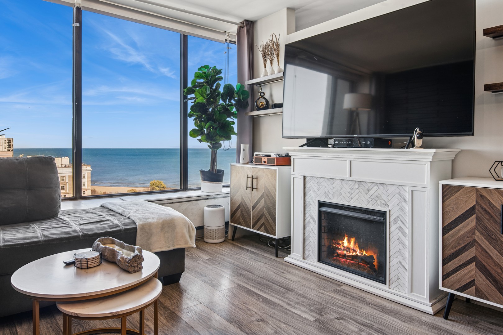 5455 North Sheridan Road, Unit 2805 Chicago, IL 60640 - Photo 8 of 20 a living room with furniture and a fireplace