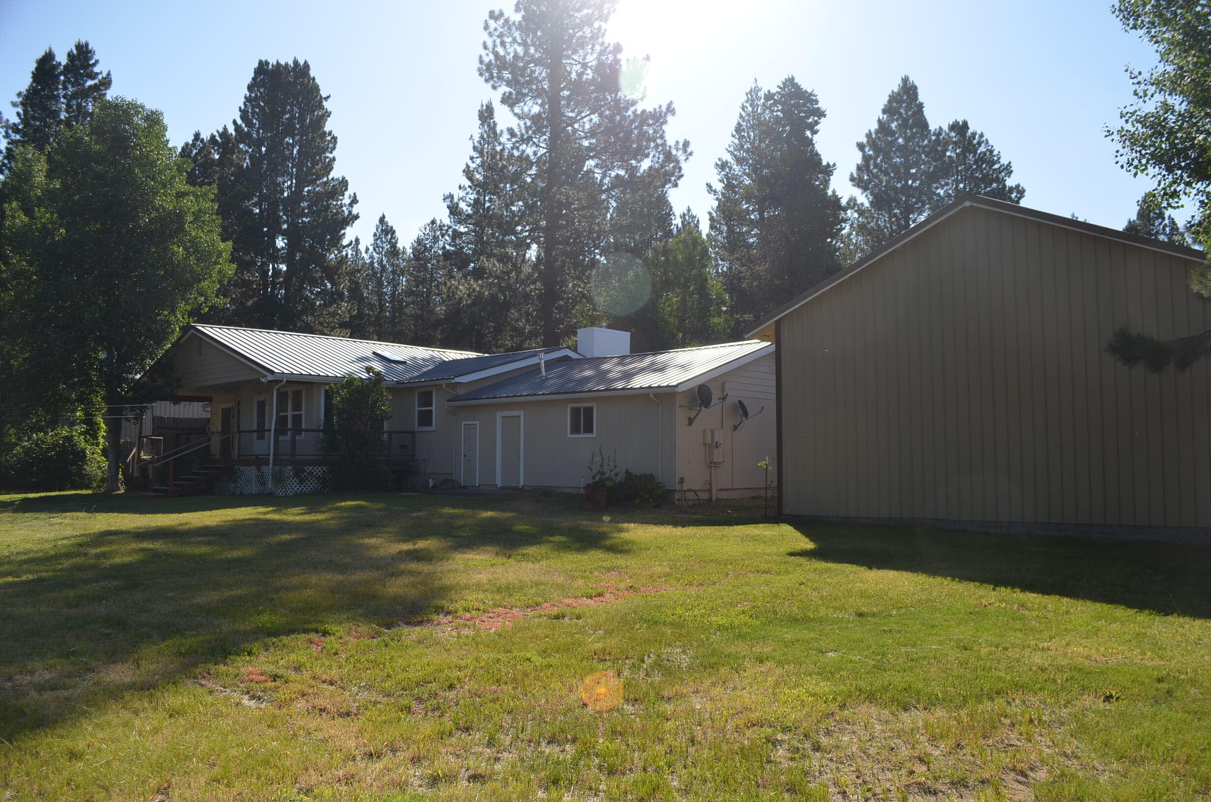 137008 Main Street Crescent, OR 97733 - Photo 38 of 50 a view of a big yard in front of a house with a large tree