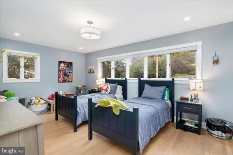 a bedroom with a bed and a table