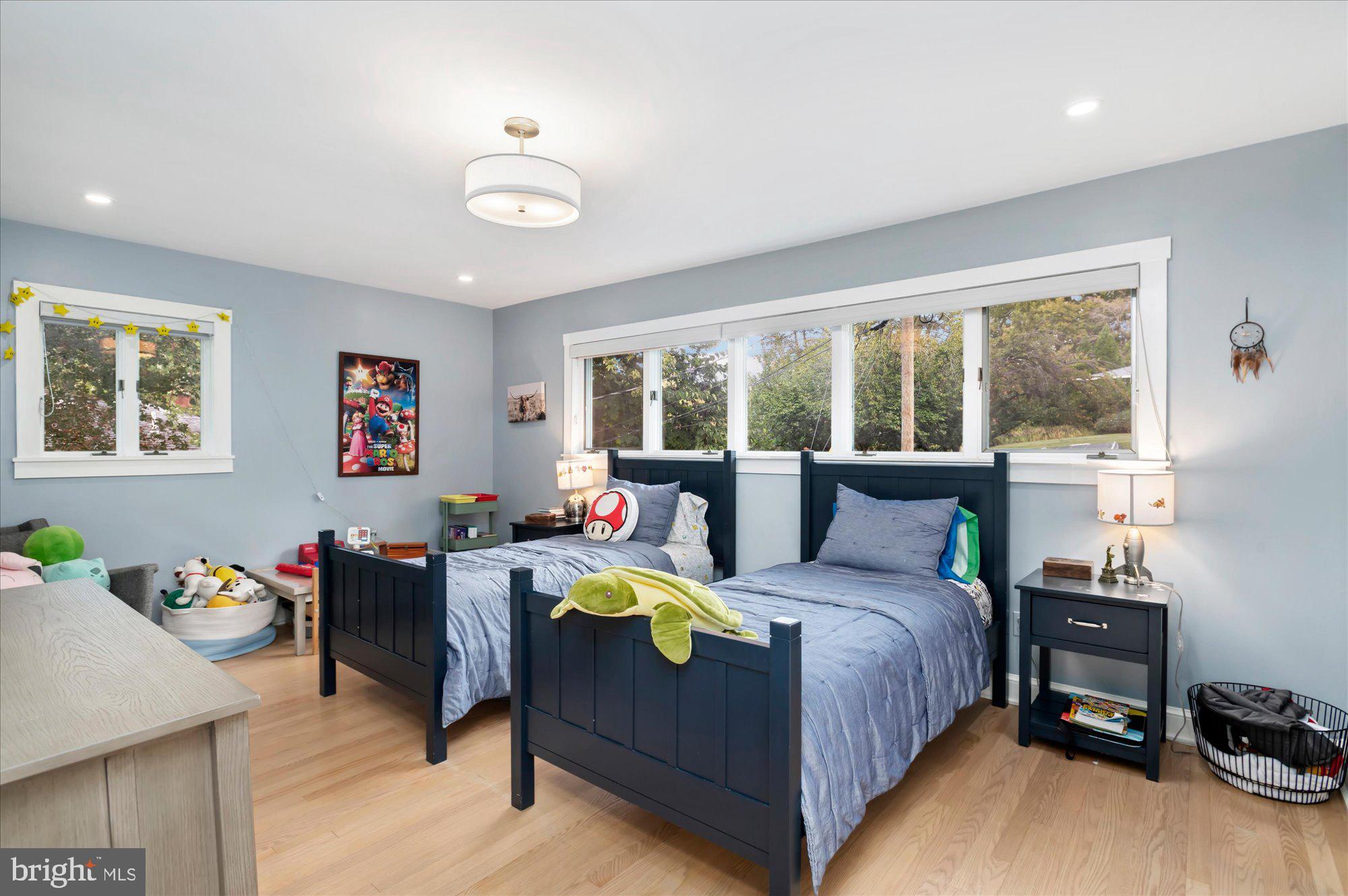 6812 Tulip Hill Terrace Bethesda, MD 20816 - Photo 16 of 35 a bedroom with a bed and a table