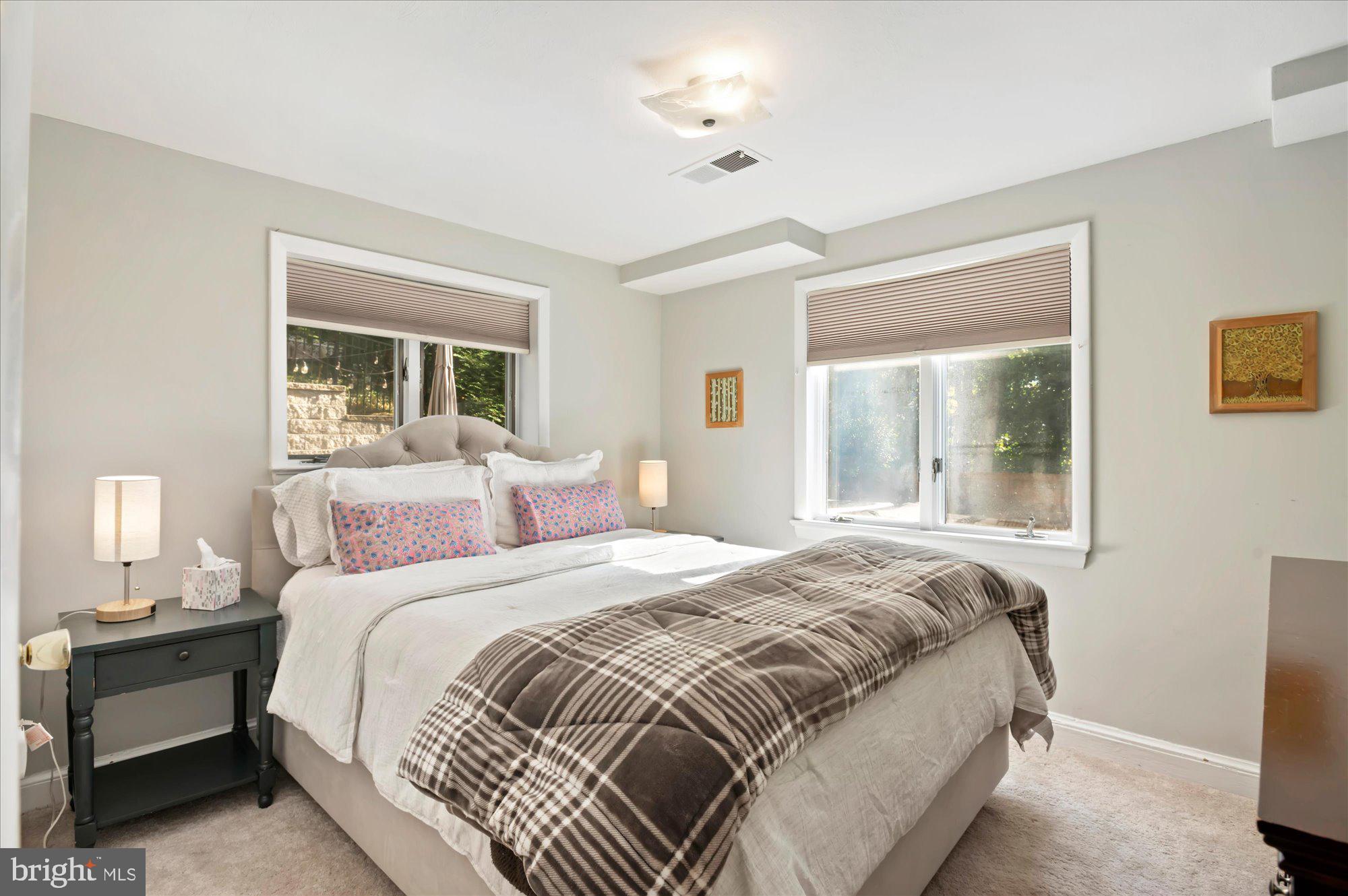 6812 Tulip Hill Terrace Bethesda, MD 20816 - Photo 22 of 35 a bedroom with a bed and a window