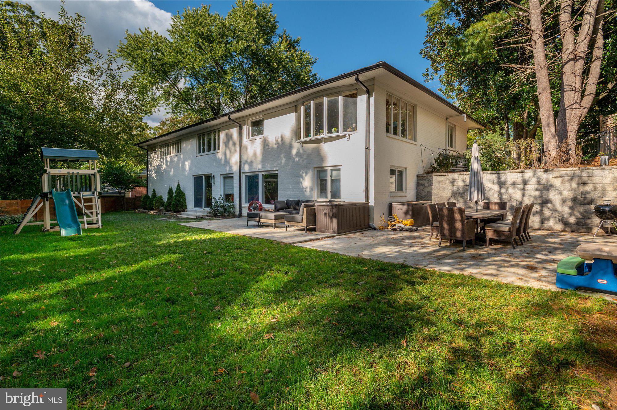 6812 Tulip Hill Terrace Bethesda, MD 20816 - Photo 24 of 35 a front view of house with yard and outdoor seating