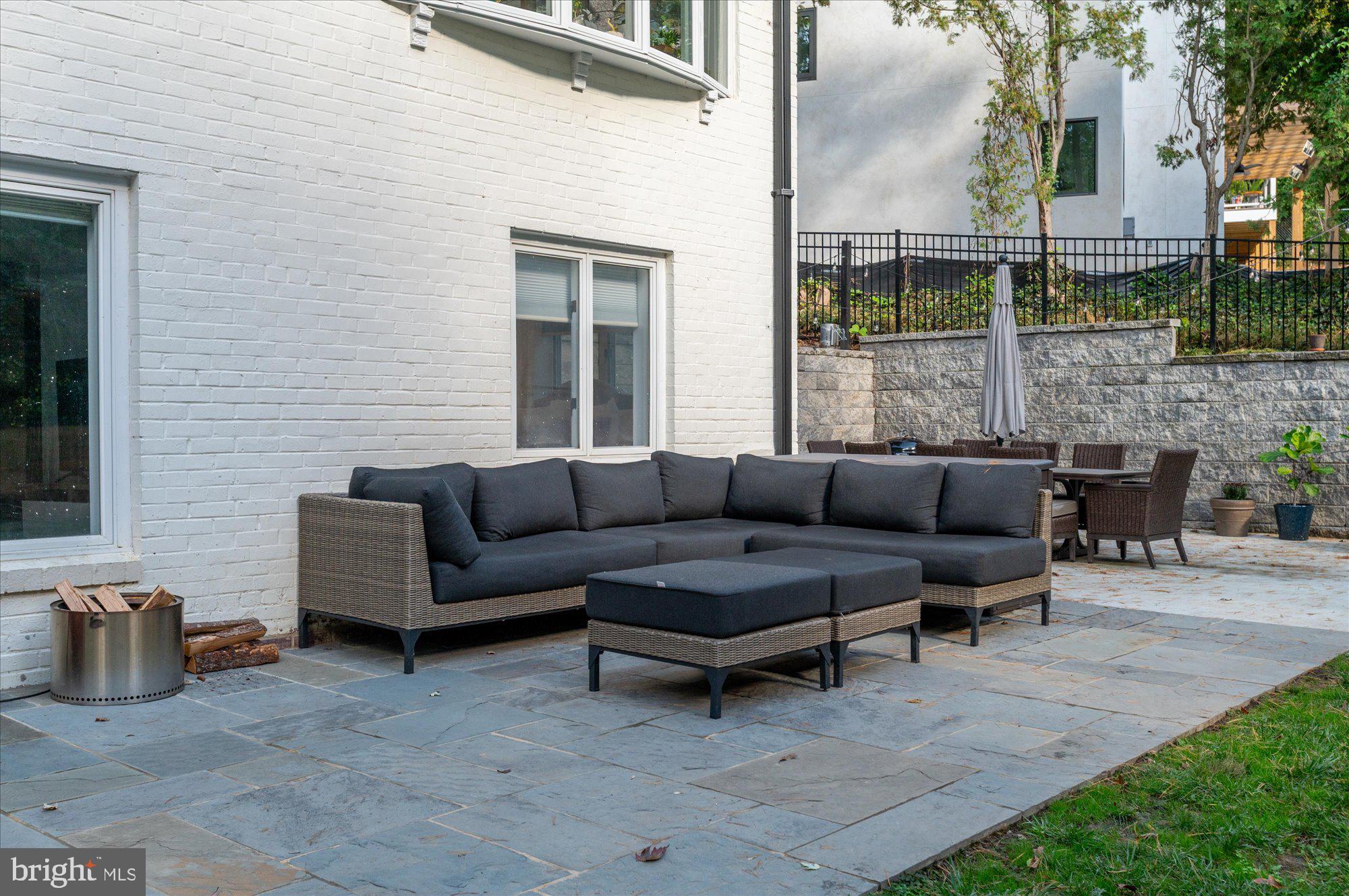6812 Tulip Hill Terrace Bethesda, MD 20816 - Photo 26 of 35 a terrace of a house with outdoor seating