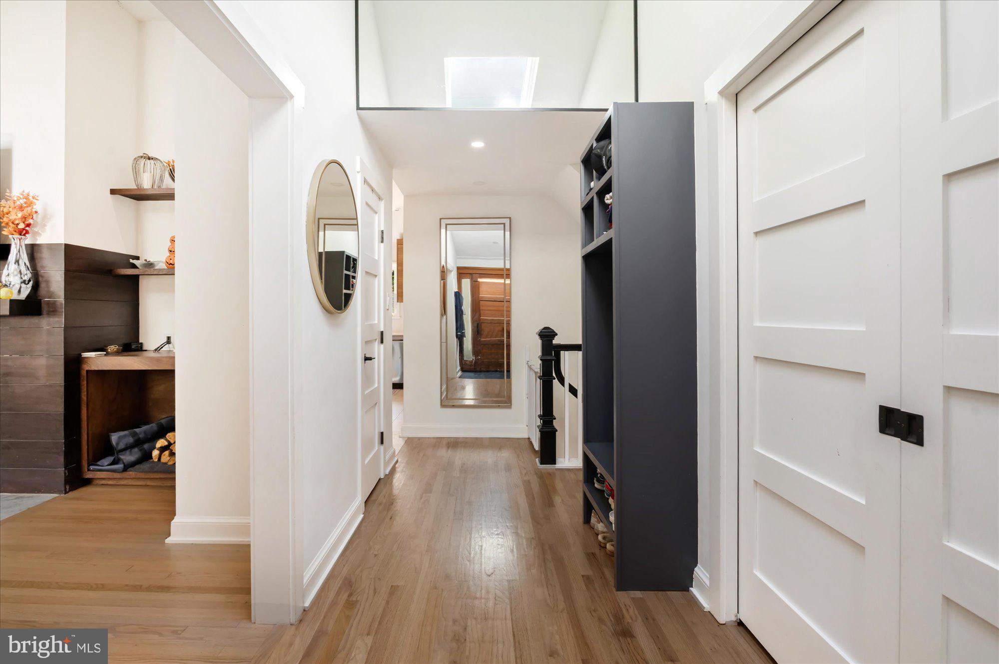 6812 Tulip Hill Terrace Bethesda, MD 20816 - Photo 3 of 35 a view of a hallway with wooden floor and staircase