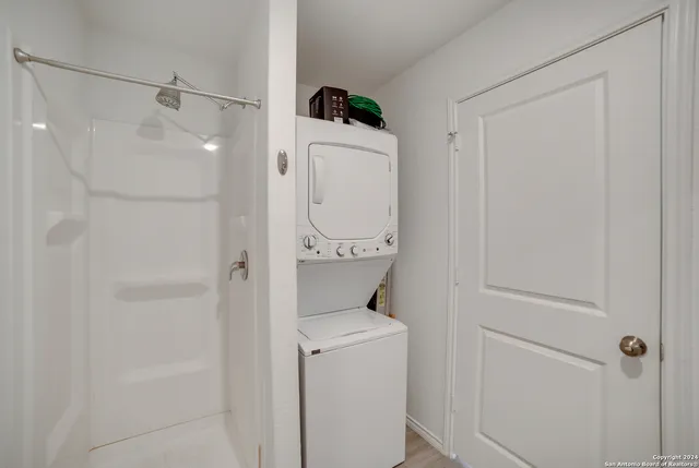 a bathroom with a shower and toilet