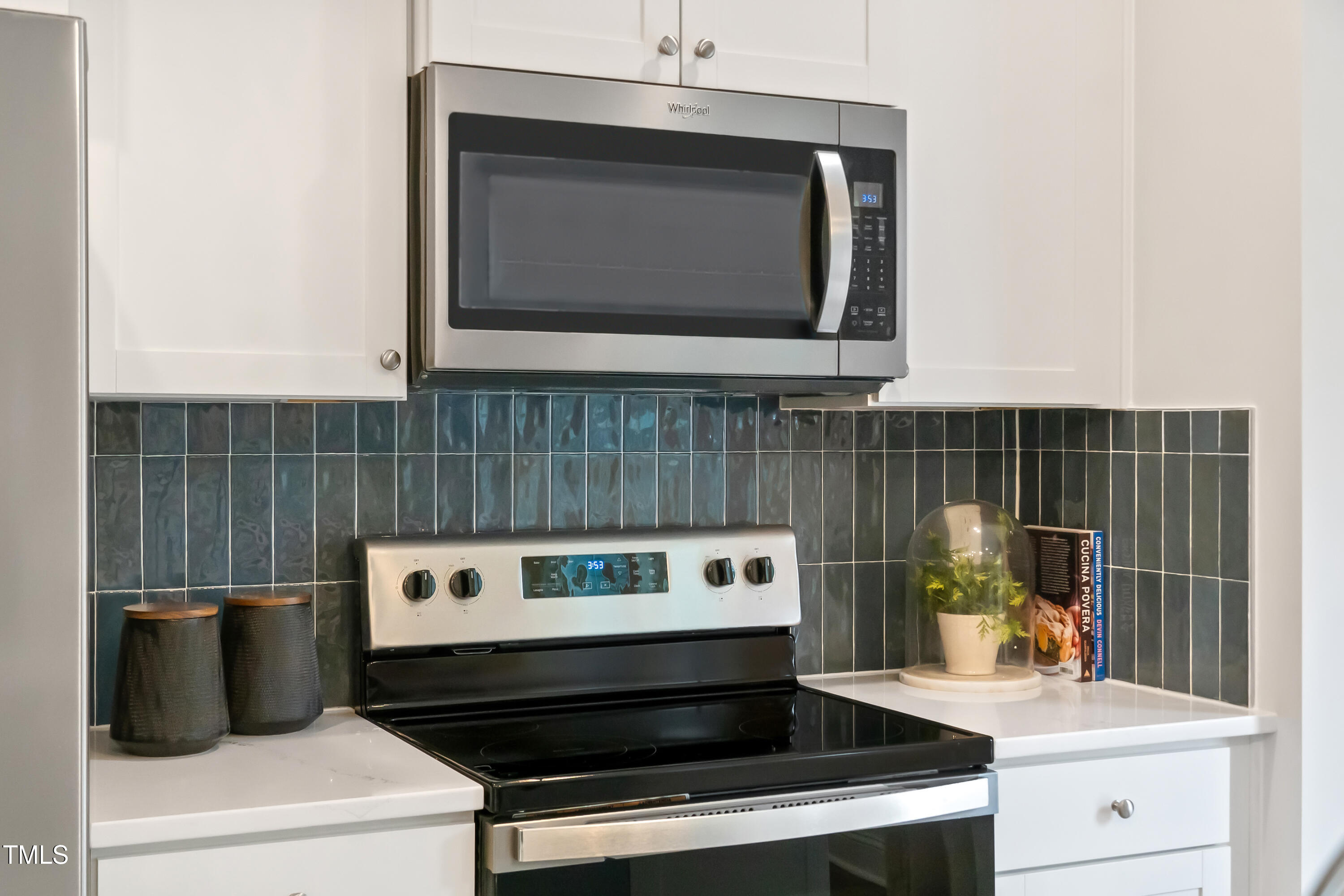 4909 Caddis Bend Raleigh, NC 27604 - Photo 13 of 30 a kitchen with a stove and a microwave