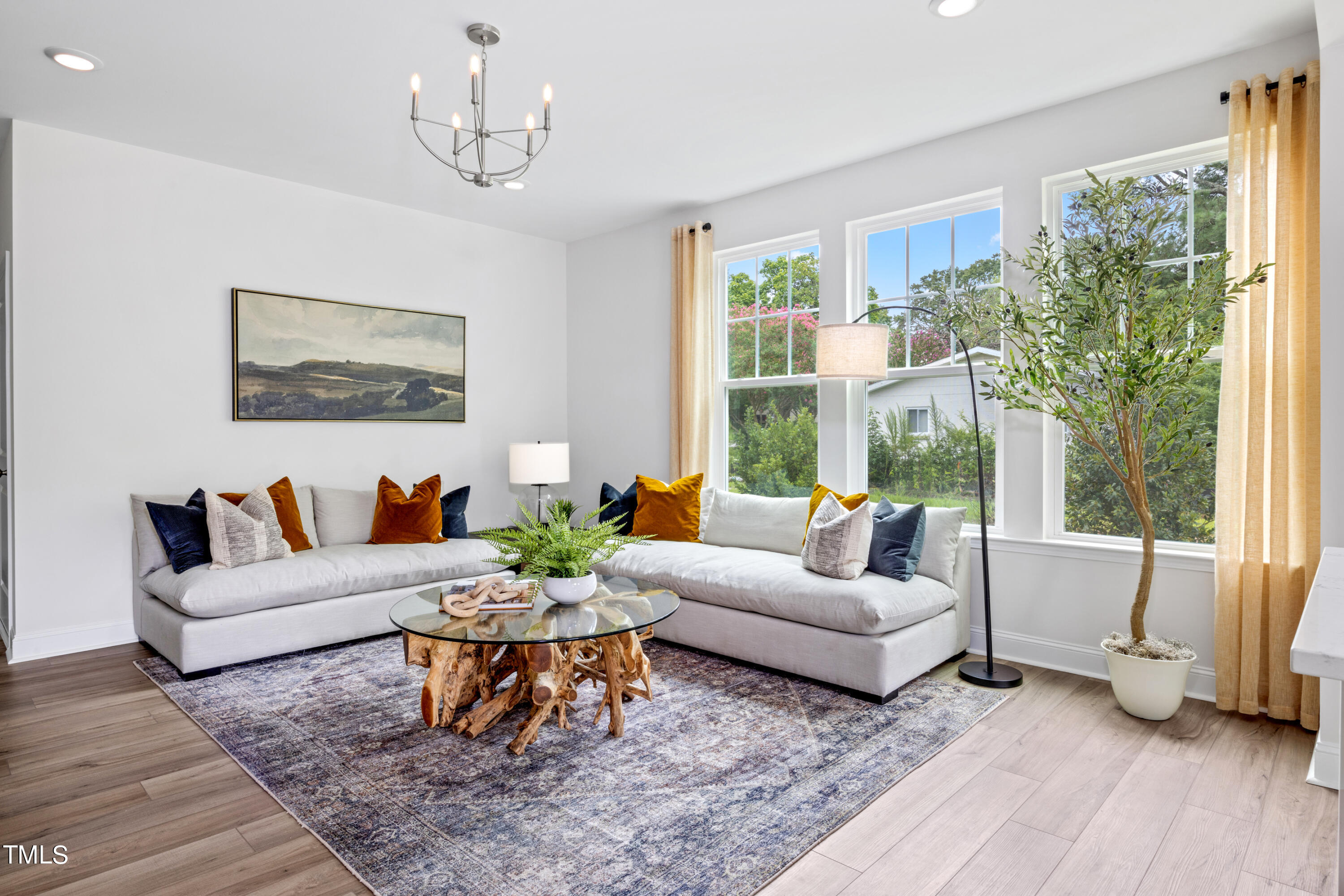 4909 Caddis Bend Raleigh, NC 27604 - Photo 24 of 30 a living room with furniture and a large window