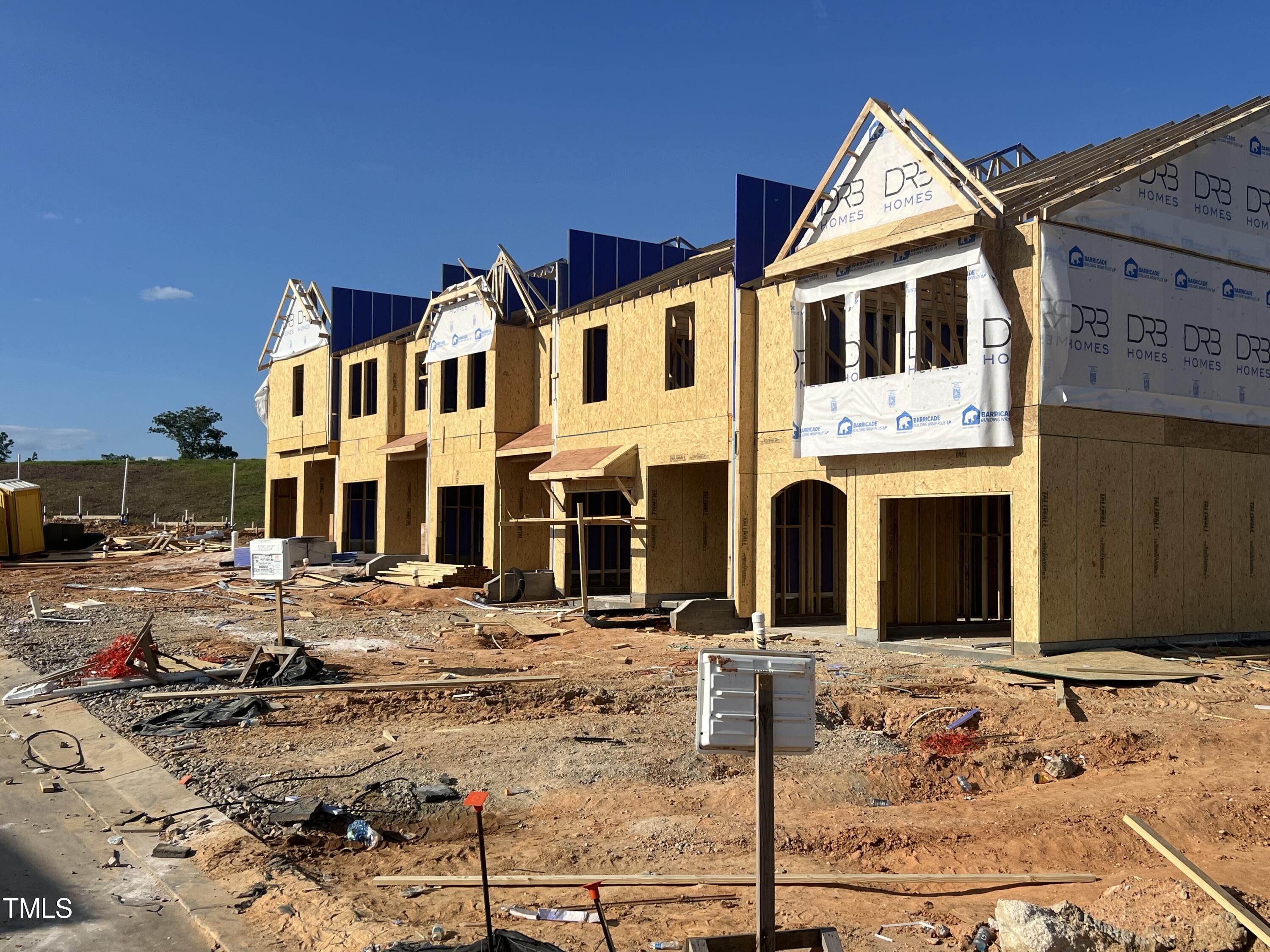 4909 Caddis Bend Raleigh, NC 27604 - Photo 29 of 30 a view of a white house with large windows