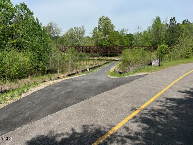 4909 Caddis Bend Raleigh, NC 27604 - Photo 5 of 30 a view of a road with a yard