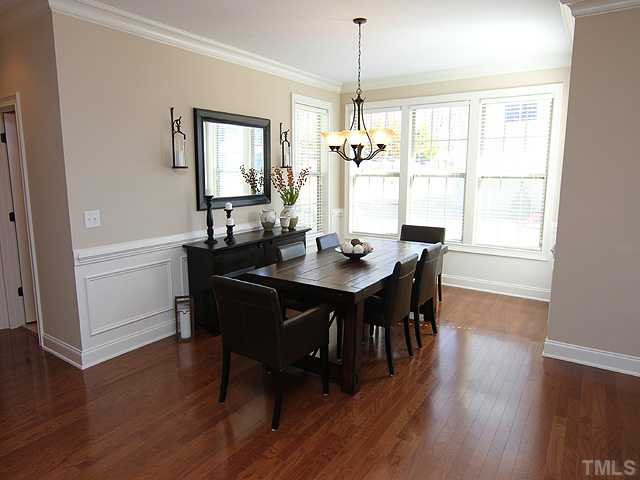 Spacious light filled dining room, with plenty of room for extra large table. Wainscoting and crown molding add to the warmth of this room. Dining Room