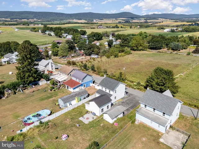 an aerial view of residential house with outdoor space