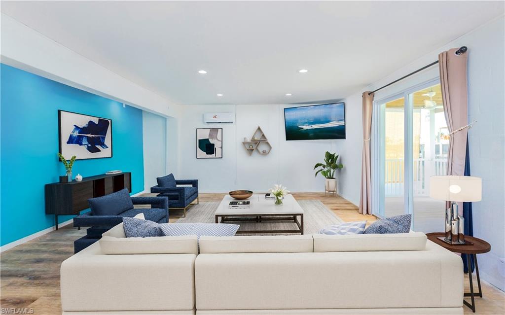 12277 Boat Shell Drive Matlacha Isles, FL 33991 - Photo 27 of 46 a living room with furniture a lamp and a window