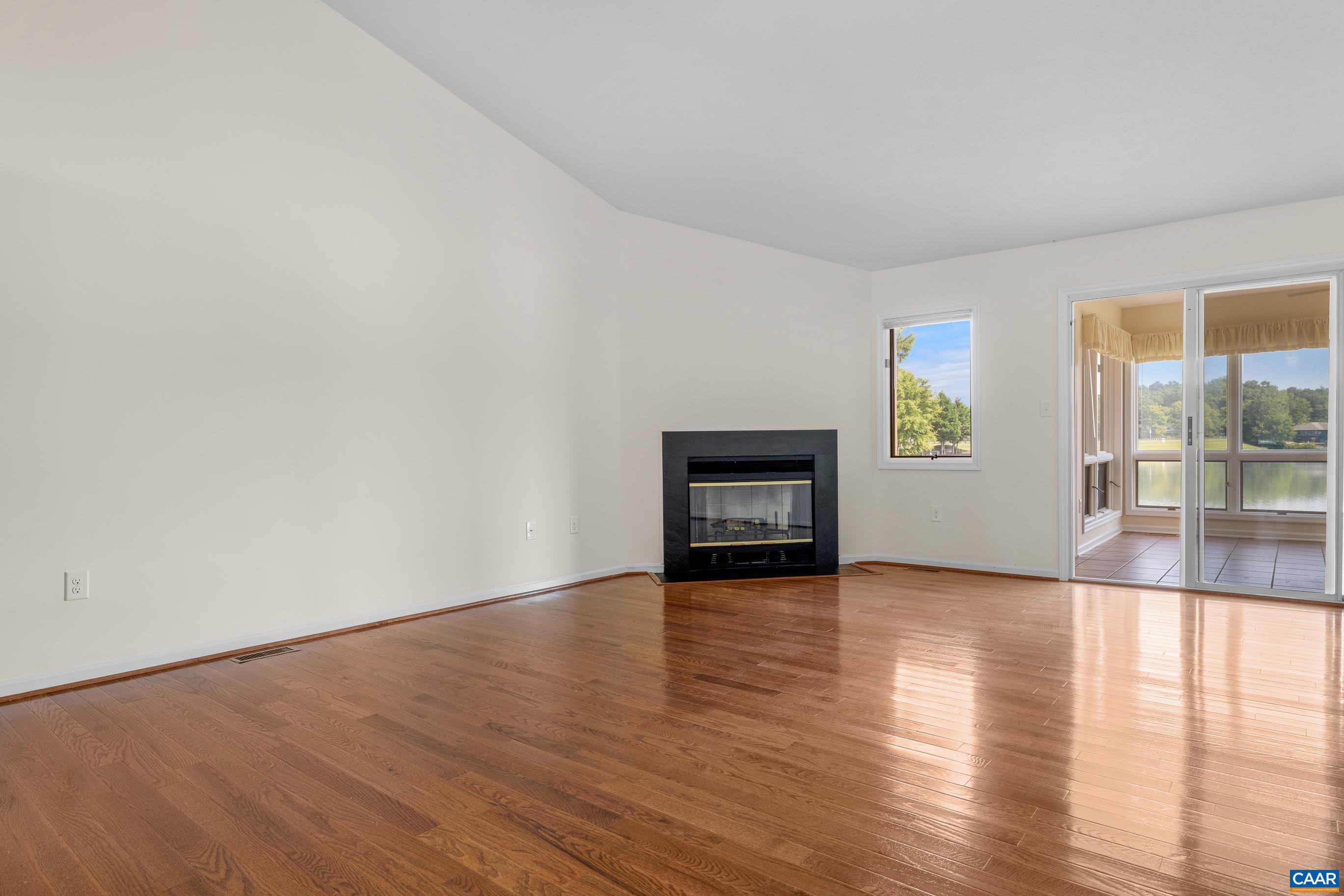 B2 Marina Point Palmyra, VA 22963 - Photo 25 of 37 a view of an empty room with glass door and wooden floor